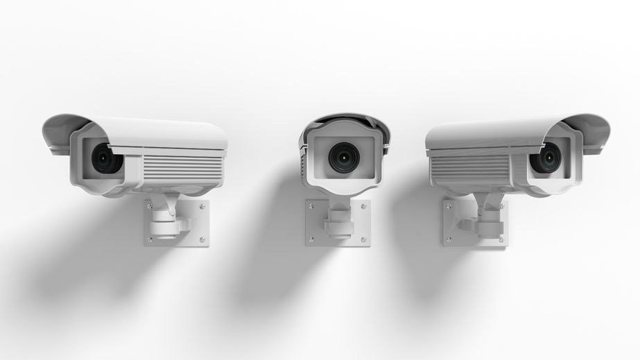 41045986 - three security surveillance cameras isolated on white background